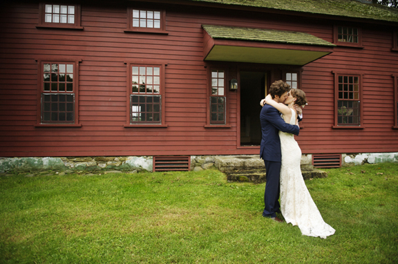 red barn wedding - couple embracing